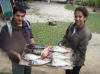 honeymoon couple with there diner after a day on the water doing some cook islands fishing
