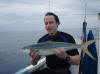 Craig with a nice rainbow runner he got spear fishing one of the Aitutaki FAD's